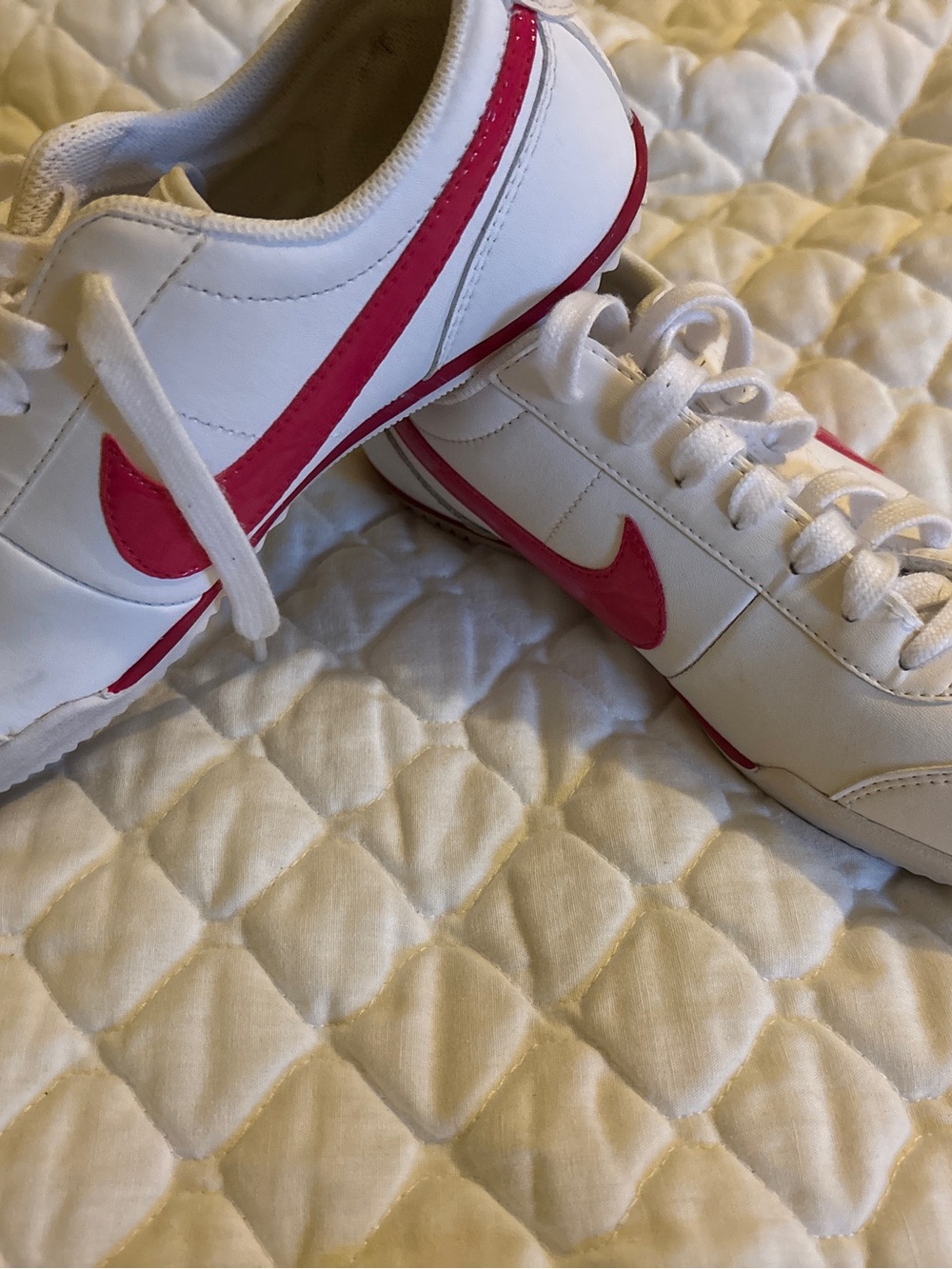Nike White Sneakers with Pink Swoosh Accents